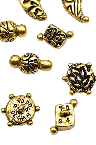 Embossed 24 kt Gold Plated Ebonized and Polished Buttons, 1994. Set of 12
