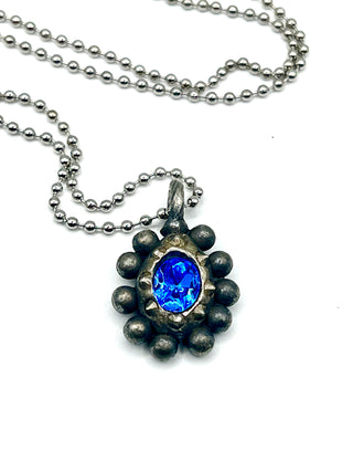 One-of-a-Kind Todd Oldham Studio Signed 1995 Silver-Plated Ebonized Rub Charm Necklace with Bright Blue Swarovski Crystal