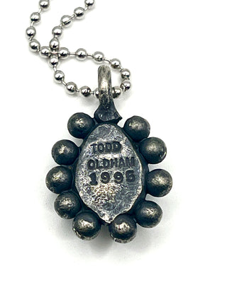 One-of-a-Kind Todd Oldham Studio Signed 1995 Silver-Plated Ebonized Rub Charm Necklace with Bright Blue Swarovski Crystal